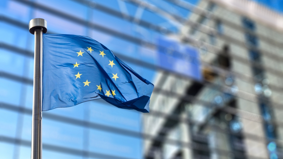 bigstock-european-union-flags-in-front-91041542-990x556
